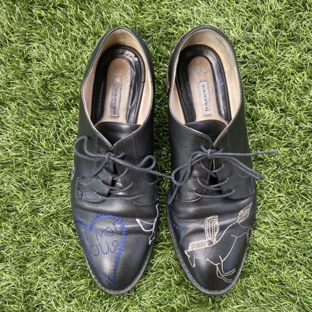 Carven leather Oxford with asymmetrical embroidery